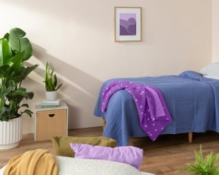 A standard twin mattress in a child’s bedroom. 