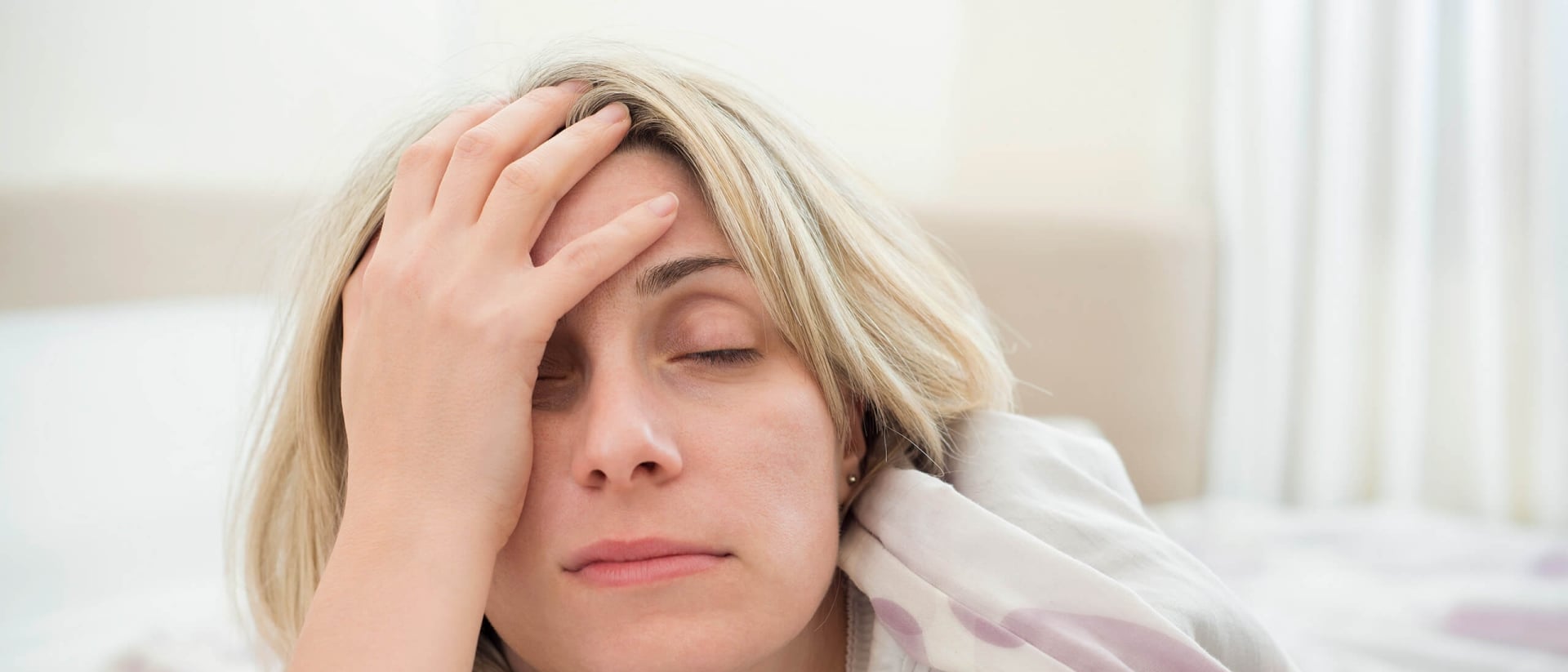A groggy woman after a night of restless sleep.