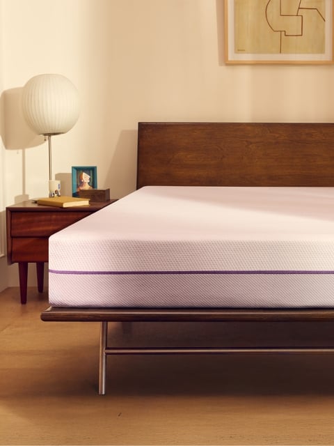 The Purple Mattress in styled bedroom